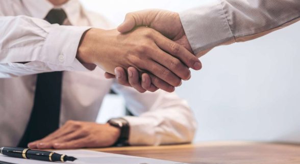 Two People Shaking Hands