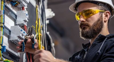 male-electrician-working-in-the-field Electrician Working in the Field